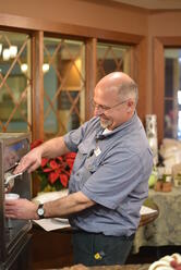 Tom Meger serves a bowl of ice cream during the Kingsway Retirement Living Christmas party. Tom Meger serves a bowl of ice cream during the Kingsway Retirement Living Christmas party.